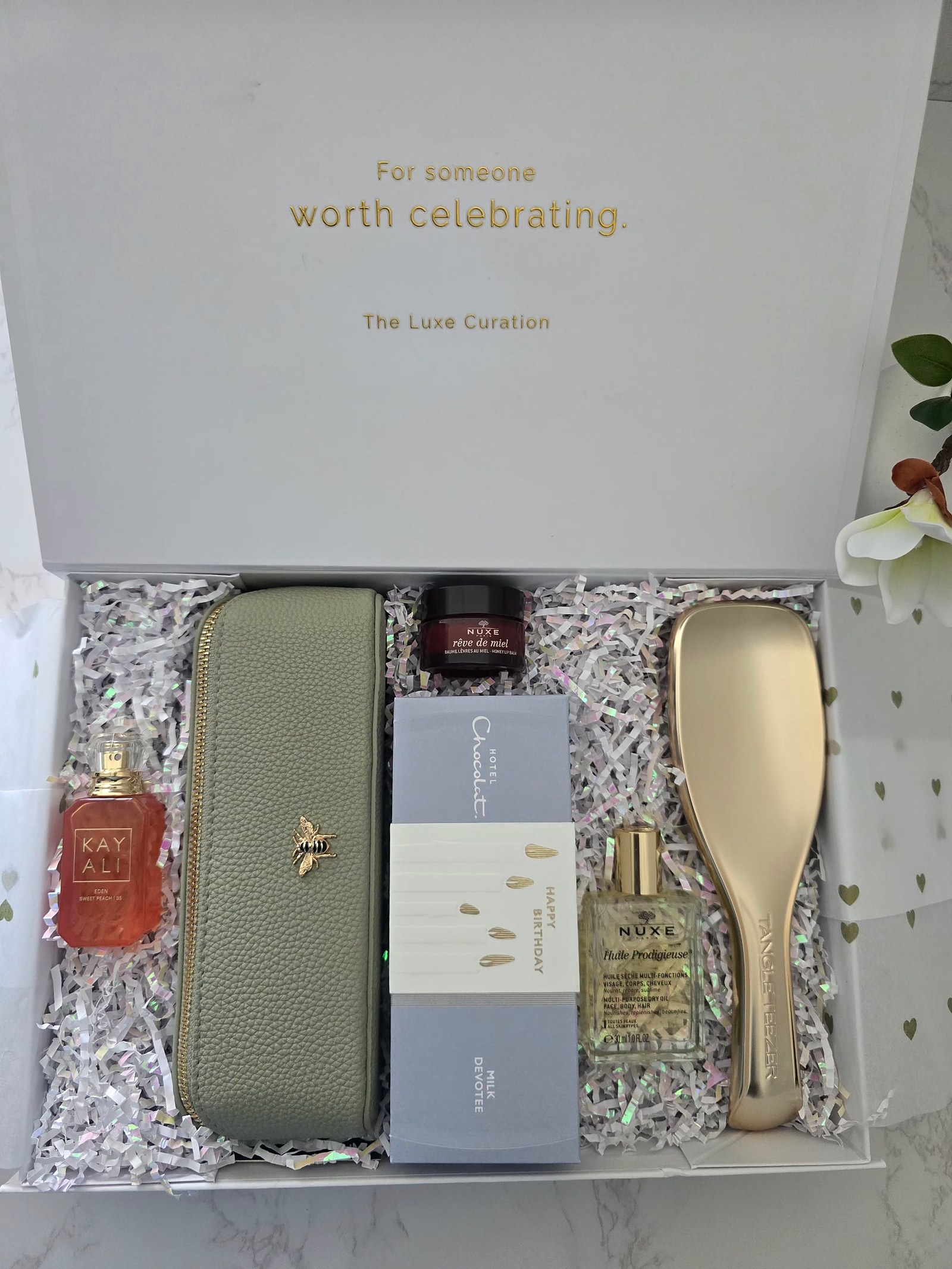 TLC box with sage bee pouch, Kayali perfume and Hotel Chocolat