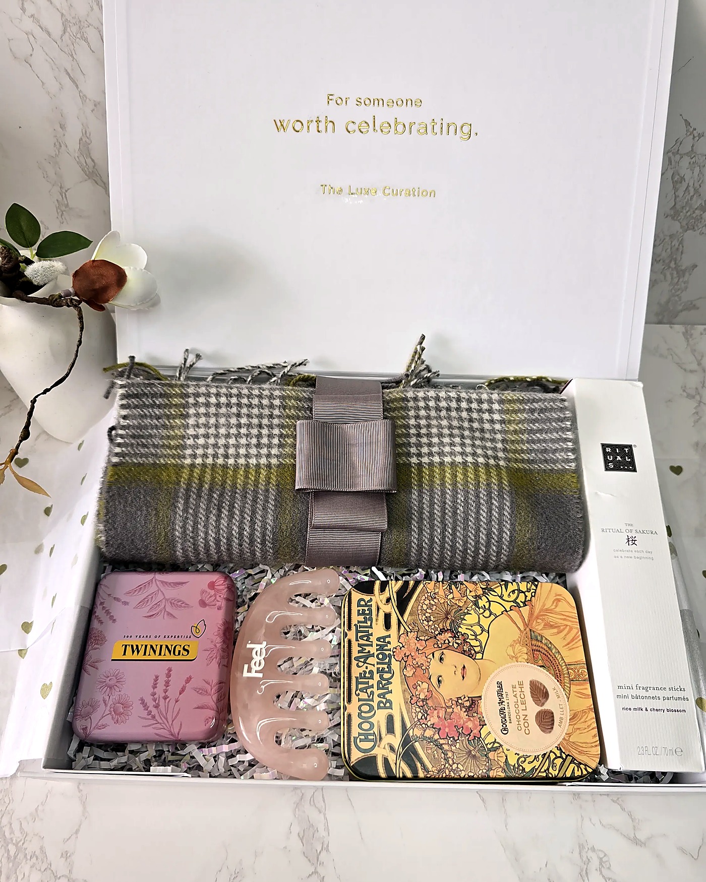 TLC box with plaid throw and chocolate tin
